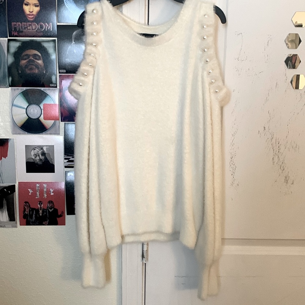 This a soft comfortable cotton white sweater.